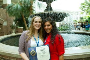 2013-2014 E-board president Brianna Kelly (left) and Secretary/Treasurer Rima Mandwee (right) display the award. (Photo/Mike Reilley)